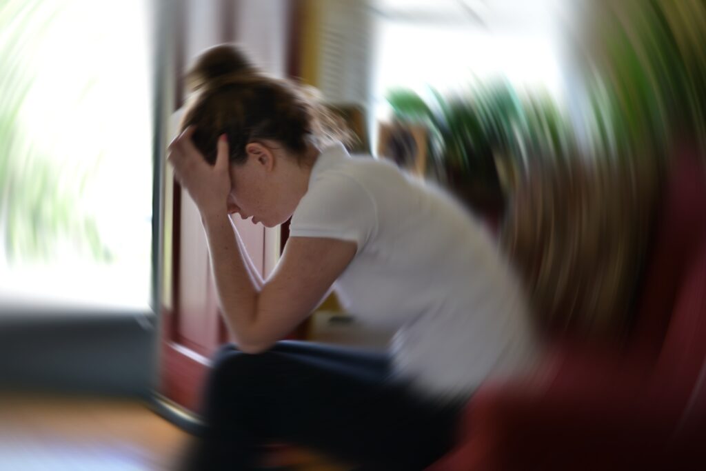 A young woman having a panic attack